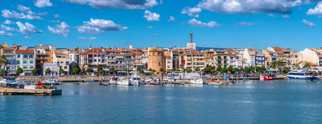 Cambrils seafront Spain boats and buildings Tarragona Province Catalonia Mediterranean sea and sky